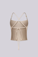 Textured knit halter crop top with adjustable tie-back straps with beads detail
Open back with crisscross tie closure