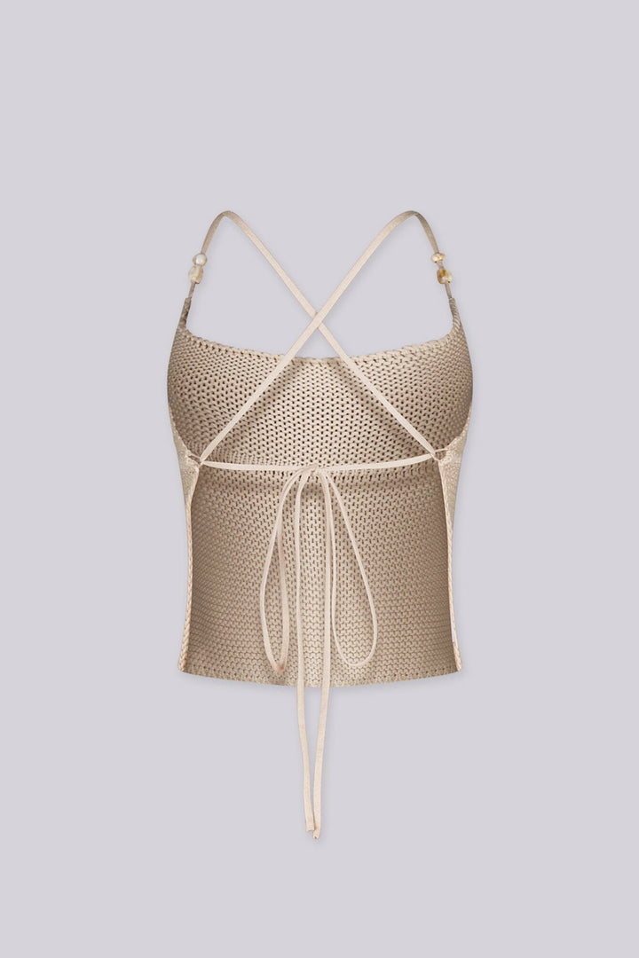 Textured knit halter crop top with adjustable tie-back straps with beads detail
Open back with crisscross tie closure
