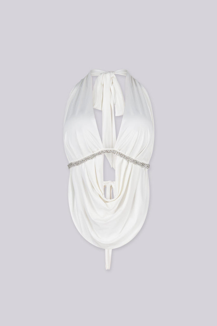 Deep plunging cowl neck top with rhinestone trim under the bust,
Featuring an open back design