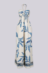Blue leaf print wide leg halter jumpsuit featuring gathered center bust detail with deep plunge notch
Side waist cut out with smocked back detail