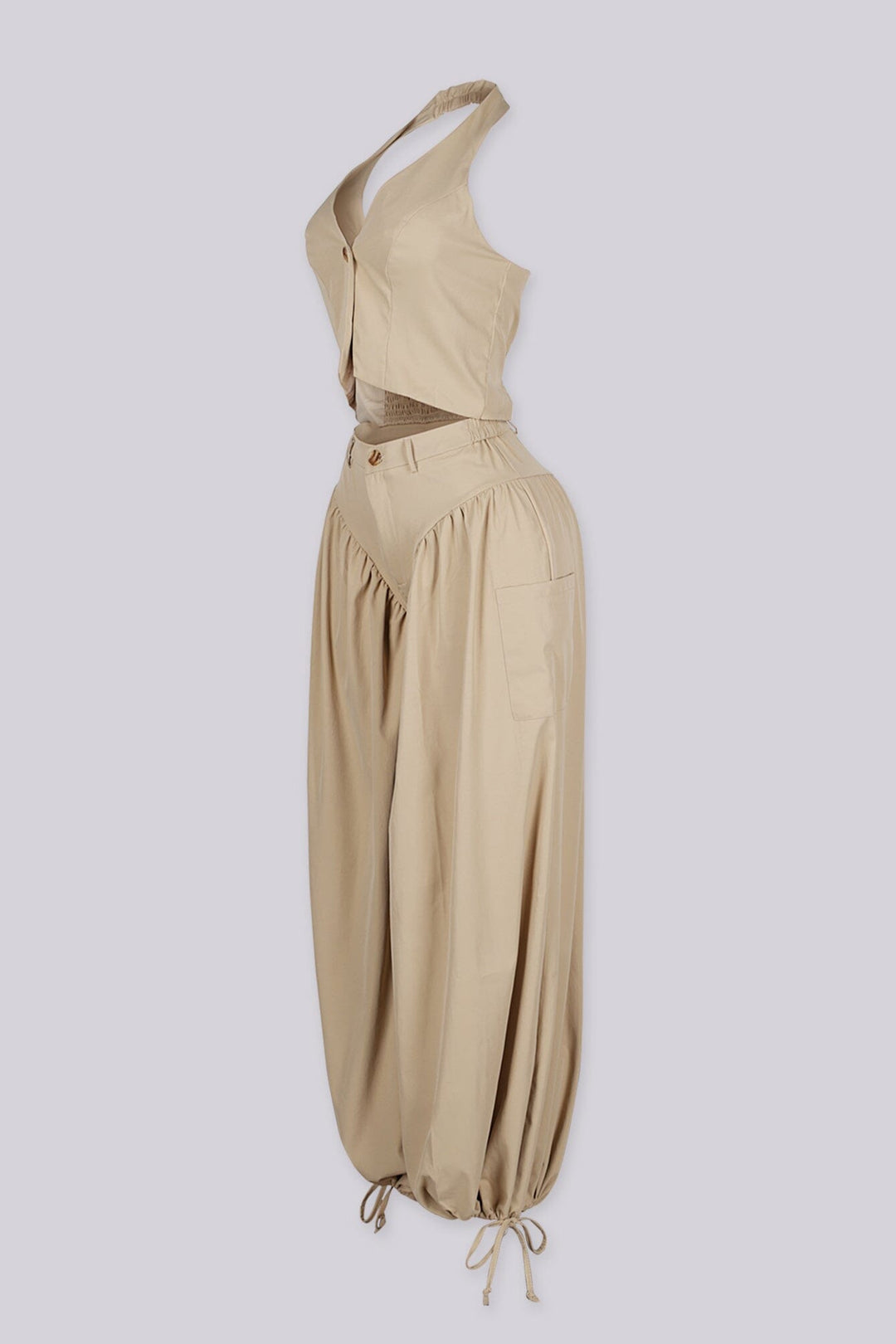 Halter crop top featuring a plunging neckline with&amp;nbsp;a peekaboo waist cutout, side view.