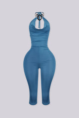 EDGEBYKS - Cowl neckline halter jumpsuit with a plunging cutout front, teal front view