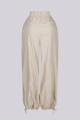 EDGEBYKS - Relaxed wide leg pants with deep inverted pleats at the high waist, bone back view