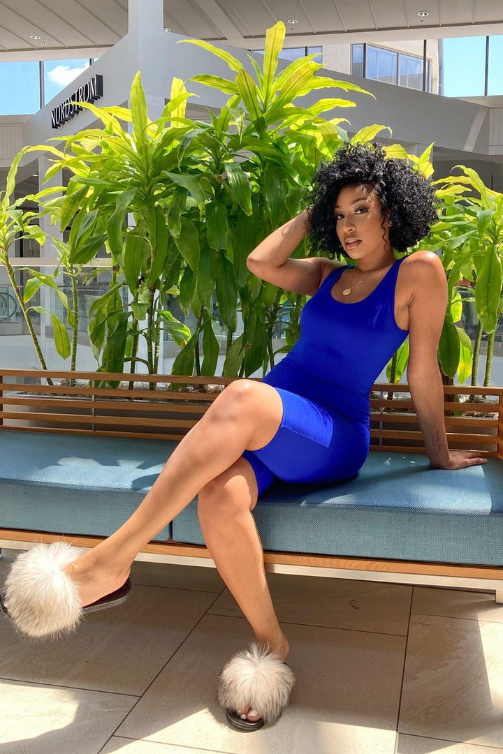 One-piece romper with a fitted tank top design, scoop neckline, and racerback-style straps