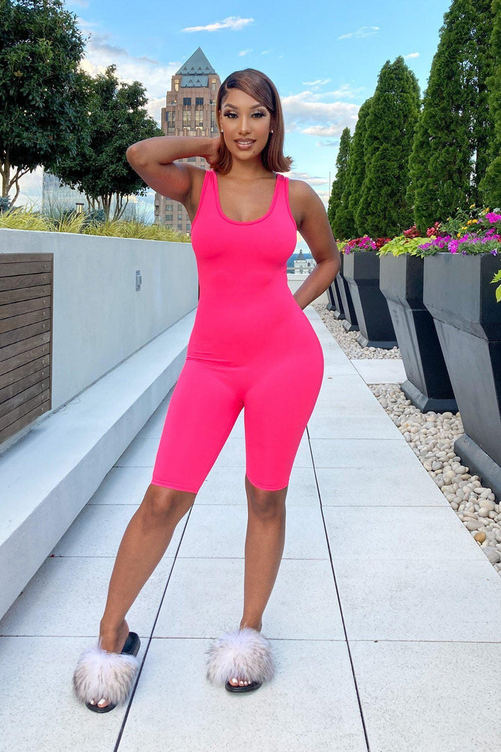 One-piece romper with a fitted tank top design, scoop neckline, and racerback-style straps