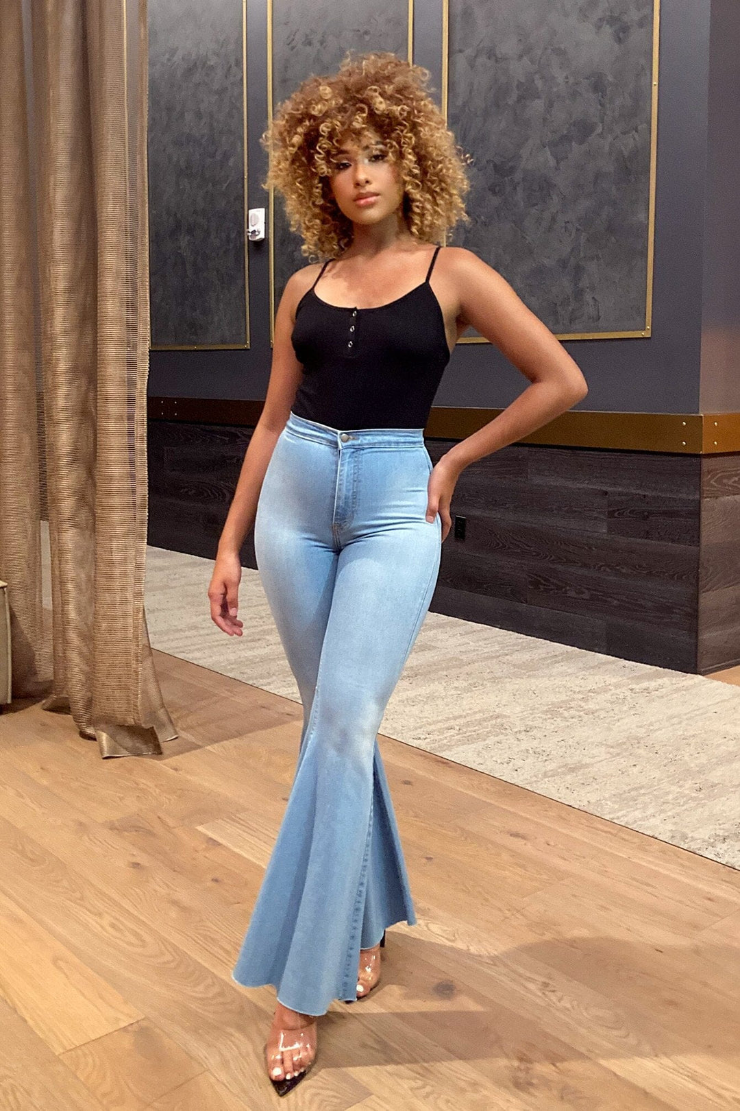 knit bodysuit with thin adjustable spaghetti straps and a scoop neckline